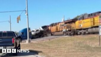 Watch: Moment train collides with lorry carrying vehicles