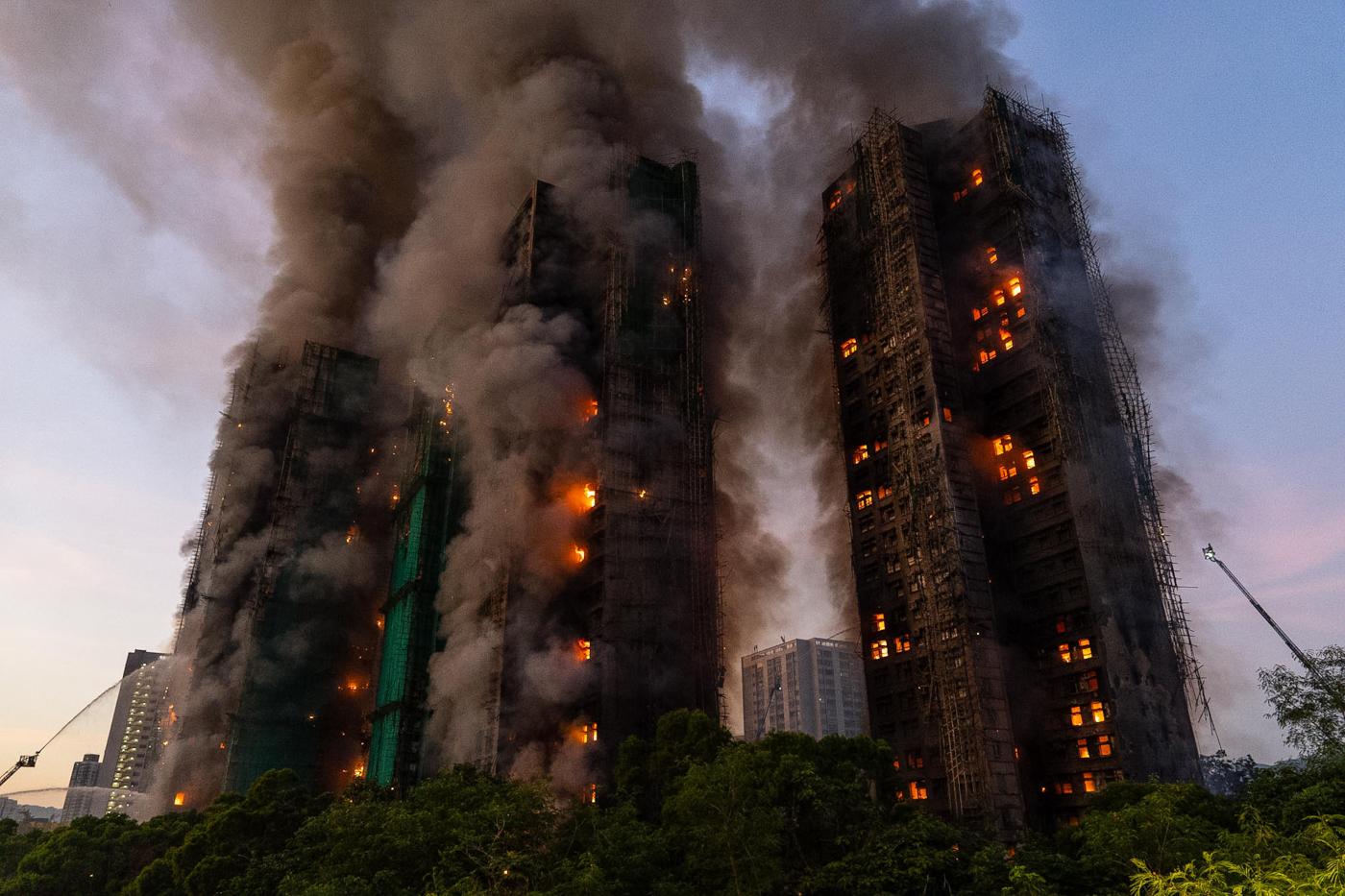 At least 13 dead after fire engulfs Hong Kong high-rise residential buildings